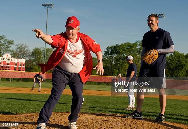 Coach Joe Barton, R-Texas, left, instructs freshman pitching candidate Rep. Duncan Hunter, R-Calif., during republican baseball practice at Four Mile...