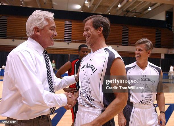 Lobbyist coach Jack Quinn, left, greets Sen. John Thune, R-S.D., before the 7th Annual Hoops for Hope basketball game that had Congressmen face...