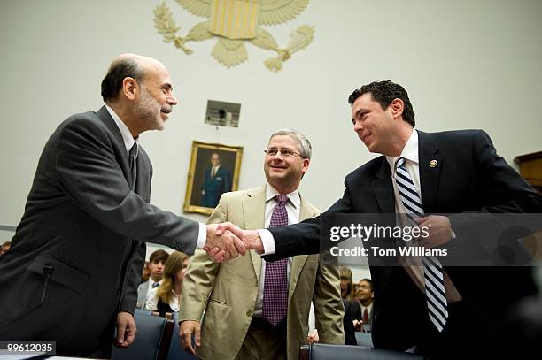 Ben Bernanke, left, chairman of the Federal Reserve, greets Reps. Jason Chaffetz, R-Utah, right, and Patrick McHenry, R-N.C., before the start of a...
