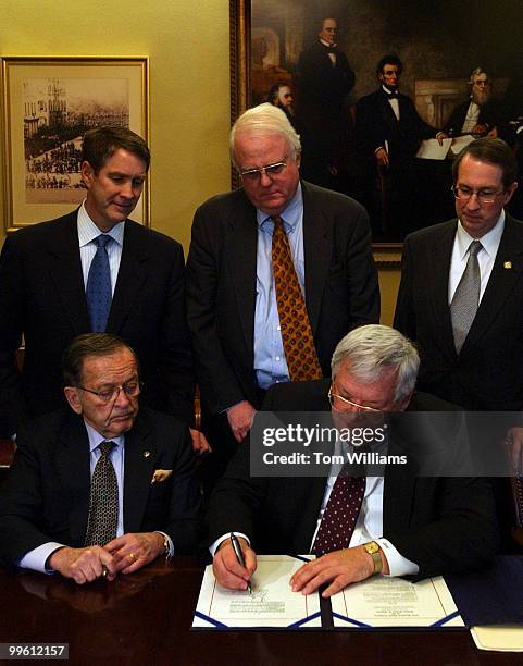 Speaker Dennis Hastert, R-Ill., signs an enrollment for the Class Action Fariness Act of 2005, which will shift many suits from State Court to...