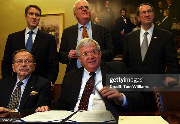 Speaker Dennis Hastert, R-Ill., closes the enrollment for the Class Action Fariness Act of 2005, after signing it, which will shift many suits from...