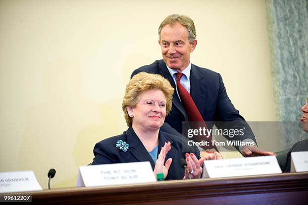 Tony Blair, former prime minister of Britain, leaves a news conference which followed a symposium entitled "U.S. Climate Change Action: A Global...