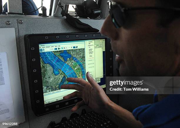 Michael Moore talks about situation awareness systems aboard a combat boat named Joint Multimission Expeditionary Craft , in the Potomac River. The...