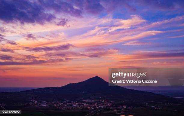 surreal twilight over the town - ciccione stock-fotos und bilder