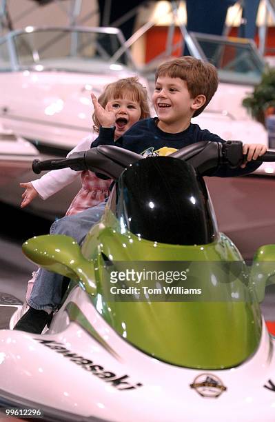 Joshua Tisone and his siter Grace, 18 months, test out a Kawasaki Jet Ski at the 43rd Annual Washington Boat Show held in the Convention Center.