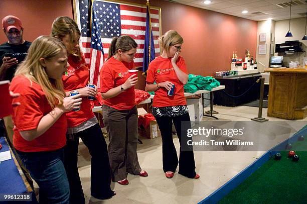 Members of team Your Bocce Makes Me Hot watch a throw during indoor bocce ball competition at the American Legion on Capitol Hill, Oct. 21, 2009.