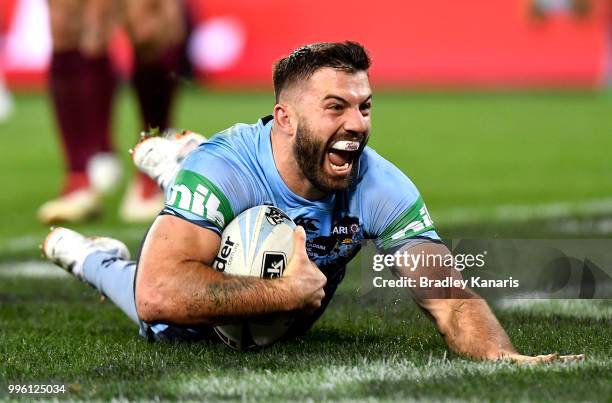 James Tedesco of the Blues scores a try during game three of the State of Origin series between the Queensland Maroons and the New South Wales Blues...