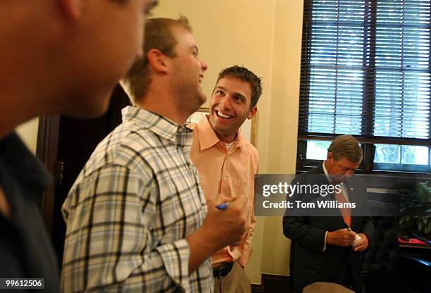 Atlanta Brave right fielder Jeff Francoeur, center, shares a laugh with catcher Brian McCann, after a meeting with Sen. Johnny Isakson, R-Ga., at...
