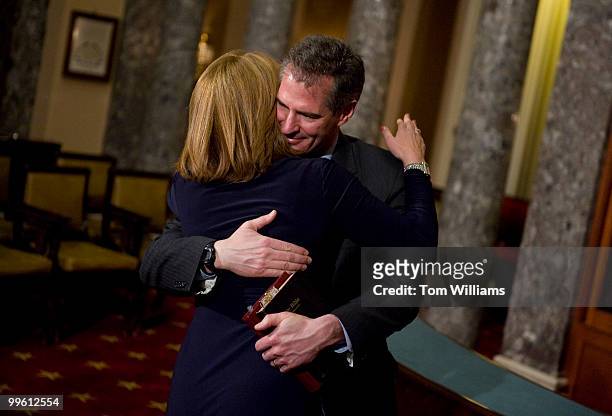 Sen. Scott Brown, R-Mass., hugs his wife Gail Huff, before a ceremonial swearing in with Vice President Joe Biden in the Old Senate Chamber, Feb. 4,...