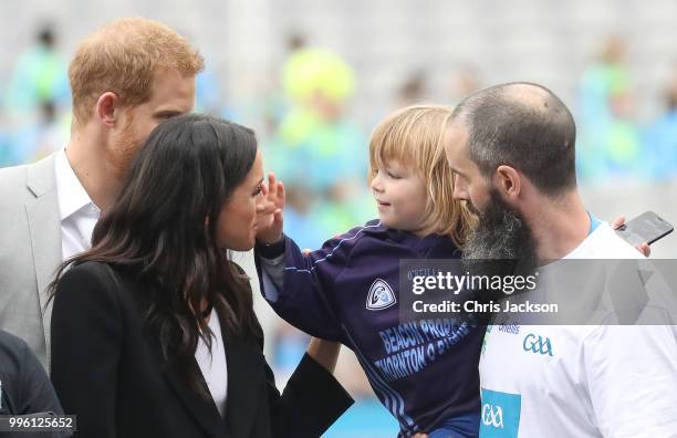 Prince Harry, Duke of Sussex and Meghan, Duchess of Sussex meet Walter Cullen, aged 3 at Croke Park, home of Ireland's largest sporting organisation,...