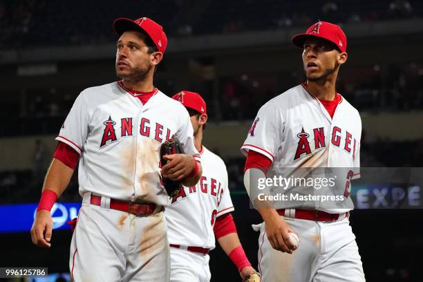 Andrelton Simmons and Ian Kinsler of the Los Angeles Angels of Anaheim looks on during the MLB game against the Seattle Mariners at Angel Stadium on...