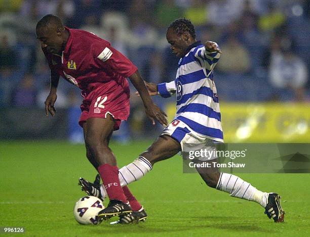 Doudou of QPR tussles with Aaron Brown of Bristol during the Queens Park Rangers v Bristol City Nationwide League Division Two match at Loftus Road,...