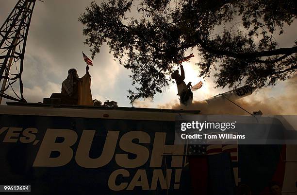 Anwar al-habub abd-al-shamns, left, and Laurel G.W. Sutherlin, believed an to be an aliases, stand on the Yes Bush Can '04 bus that is touring the...