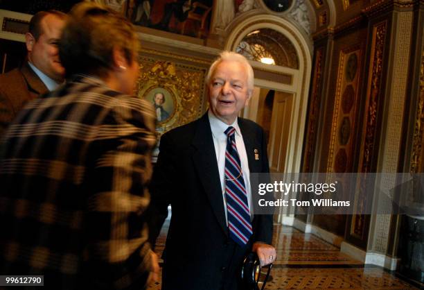 Sen. Robert Byrd, D-W.V., is congratulated by Assistant Doorkeeper Krista Beal, on his way to the Senate Floor on the day he became the longest...