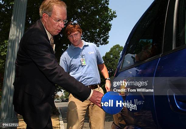 Chairman of the Senate Renewable Energy and Energy Efficiency Caucus Sen. Wayne Allard, R-Colo., checks out a General Motors hydrogen fuel cell...