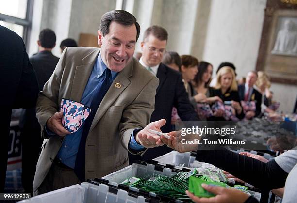 Rep. Joe Donnelly, D-Ind., participates in a USO event in Rayburn to make 2000 care packages specifically for female troops deployed overseas, Nov....