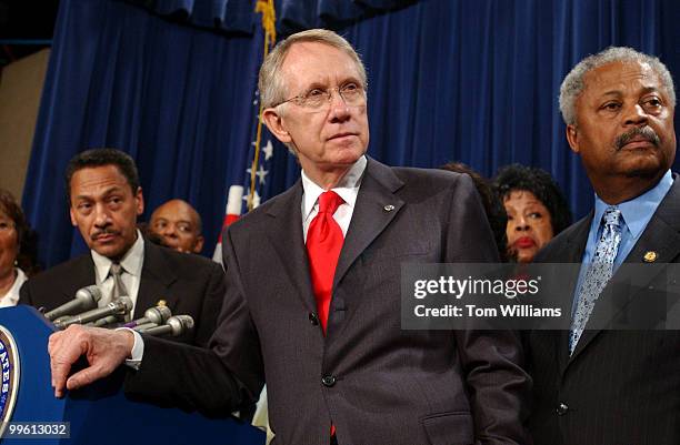 Congressional Black Caucus Chairman, Mel Watt, D-N.C., left, holds a news conference with Senate Majority Leader Harry Reid, D-Nev., center, and...