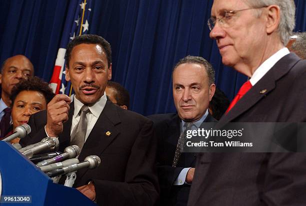 Congressional Black Caucus Chairman, Mel Watt, D-N.C., left, holds a news conference with Senate Majority Leader Harry Reid, D-Nev., right, and...