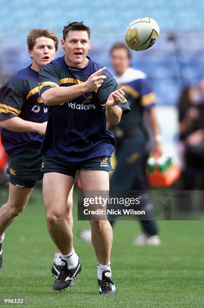 Matt Burke of Australia throws his pass during a last training session ahead of the Tri Nations last Test against the All Blacks on Saturday night at...