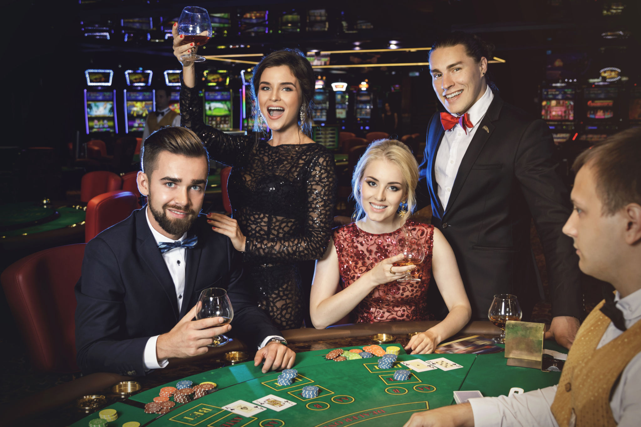Happy and rich people celebrating successful game Happy and rich people celebrating successful game