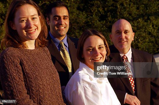 Secretary of Energy Spence Abraham, congratulates, from right, Jack and Laurie Corkey of St. Ann's Episcopal Church in Reston, Va., Chris Russell,...