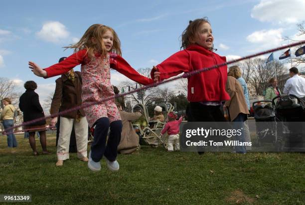 Lyla Ward left, and and Emma Jenks jump rope while waitng for a parade of elephants from the Ringling Brothers Barnum and Bailey Circus, along...