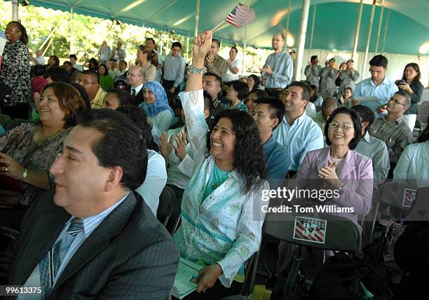 Alicia Guillermo of Ecuador, celebrates a after being sworn in as a U.S. Citizen during a ceremony at Mount Vernon, Va.