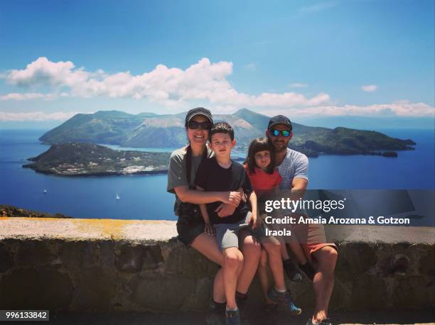 family with two children in aeolian islands, italy - isola di lipari foto e immagini stock