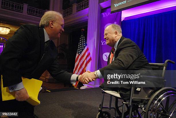 Former Senator Max Cleland, right, greets former White House Deputy Chief of Staff, Karl Rove during an event hosted by Yahoo at the Willard...