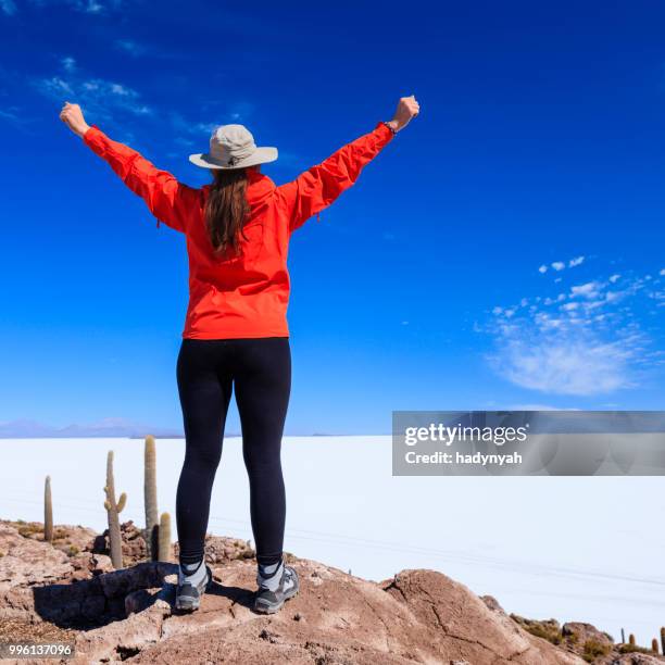 female tourist on isla wasi, salar de uyuni - salar stock pictures, royalty-free photos & images