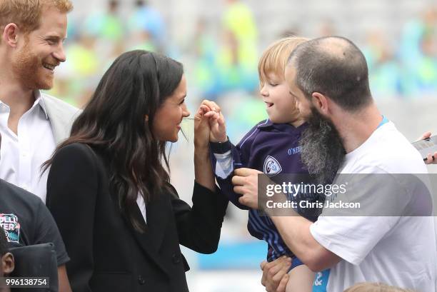 Prince Harry, Duke of Sussex and Meghan, Duchess of Sussex meet Walter Cullen, aged 3 at Croke Park, home of Ireland's largest sporting organisation,...