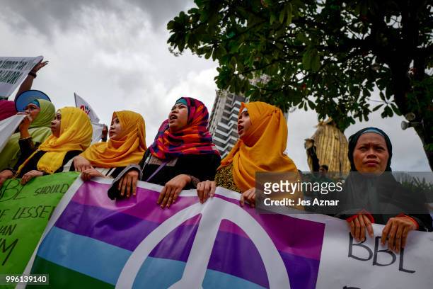 Muslim and Christian activists hold a picket during the bicameral talks between Philippine senate and congress that would determine the fate the...