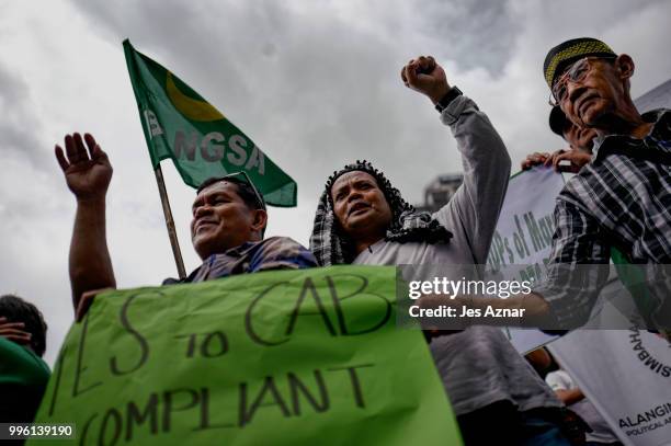 Muslim and Christian activists hold a picket during the bicameral talks between Philippine senate and congress that would determine the fate the...