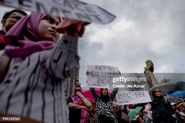 Muslim and Christian activists hold a picket during the bicameral talks between Philippine senate and congress that would determine the fate the...