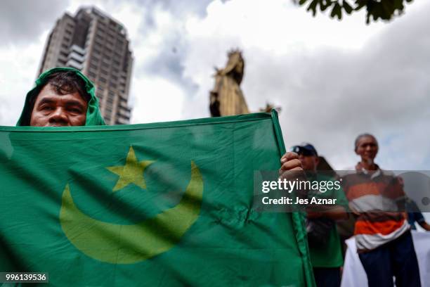 Muslim and Christian activists hold a picket during the bicameral talks between Philippine senate and congress that would determine the fate the...