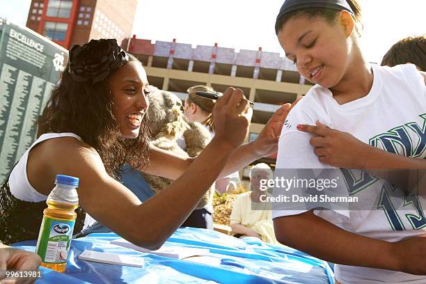 Candice Wiggins of the Minnesota Lynx signs augographs at the Lynx Pregame Party prior to the Lynx 2010 season home opening game against the...