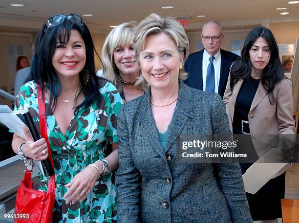 From left, singer and former foster child Maria Conchita Alonso, Daphna Ziman, founder of Children Uniting Nations Vision, Sen. Hillary Clinton,...