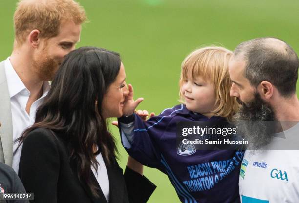 Prince Harry, Duke of Sussex and Meghan, Duchess of Sussex meet Walter Cullen, aged 3 at Croke Park, home of Ireland's largest sporting organisation,...