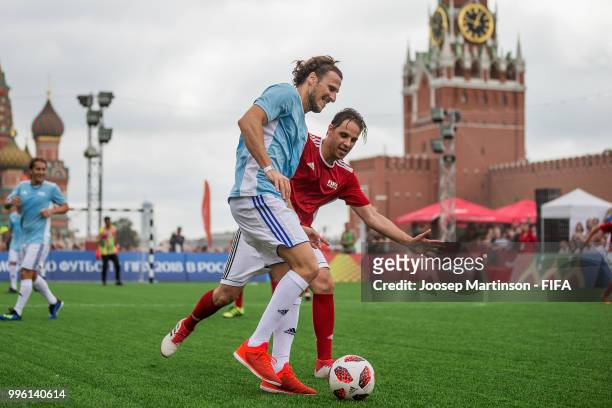Nuno Gomes competes with Diego Forlan during the Legends Football Match in Red Square on July 11, 2018 in Moscow, Russia.