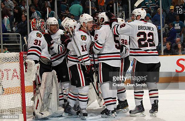 Antti Niemi, Jonathan Toews, Troy Brouwer and the Chicago Blackhawks celebrate their win over the San Jose Sharks in Game One of the Western...