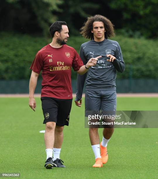Matteo Guendouzi with Arsenal fitness coach Barry Solan during a training session at London Colney on July 11, 2018 in St Albans, England.