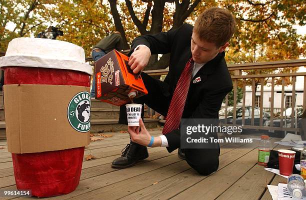 Andrew Kohan, a George Washington University student, prepares to deliver coffee to the Hart Building office of Senate Majority Leader Bill Frist,...