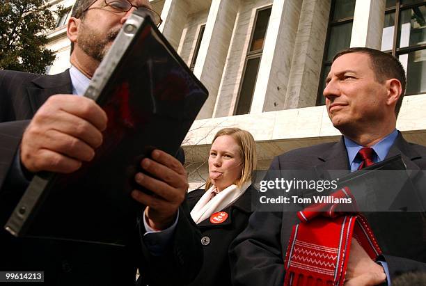 Jessie Raeder, displays her feelings for Samuel Alito, while Rev. Patrick Mahoney, left, of the Christian Defense Coalition, and Rev. Rob Schenck, of...