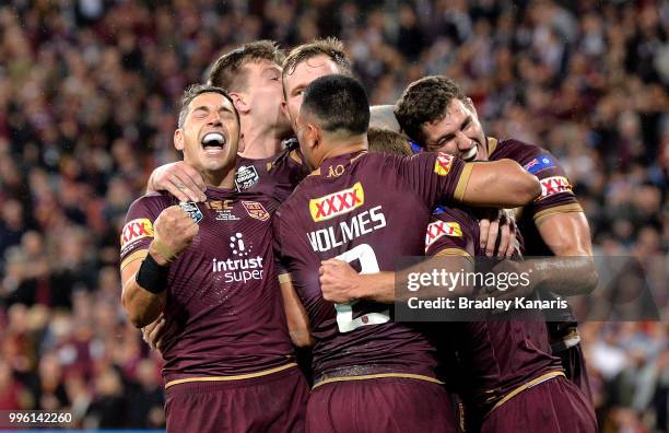 Billy Slater and team mates are seen celebrating after Daly Cherry-Evans of Queensland scores a try during game three of the State of Origin series...