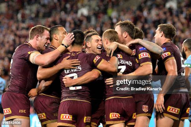 Billy Slater and team mates are seen celebrating after Daly Cherry-Evans of Queensland scores a try during game three of the State of Origin series...