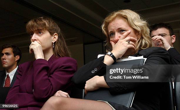 Sharon Tucker, left, from the office of Rep. Jerry Kleczka, D-Wis., and her friend Ginny Stoger, who was on the Hill lobbing, react to a video of...