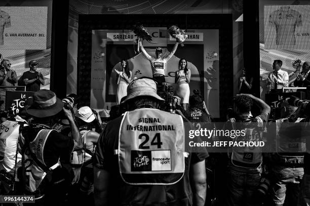 Belgium's Greg Van Avermaet, wearing the overall leader's yellow jersey, celebrates on the podium after the fourth stage of the 105th edition of the...