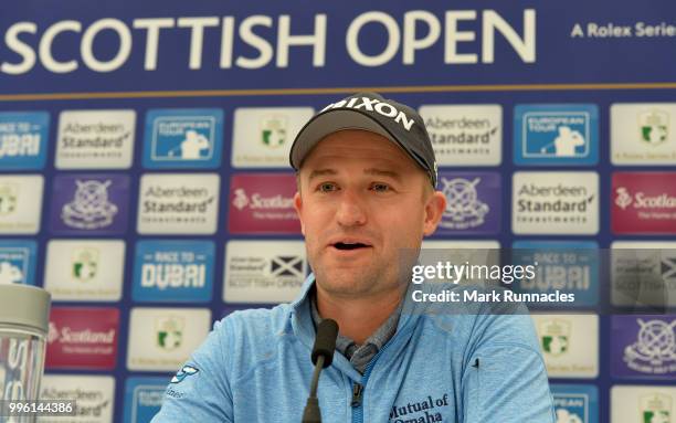 Russell Knox of Scotland speaks to the media during previews for the Aberdeen Standard Investments Scottish Open at Gullane Golf Course on July 11,...