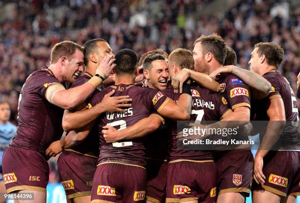Billy Slater of Queensland and team mates are seen celebrating a try by team mate Daly Cherry-Evans during game three of the State of Origin series...