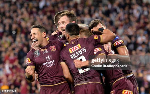 Billy Slater of Queensland and team mates are seen celebrating a try by team mate Daly Cherry-Evans during game three of the State of Origin series...